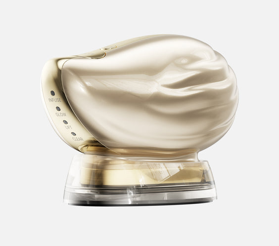TAFITIE Conch ultrasonic facial device on its clear charging base, side view