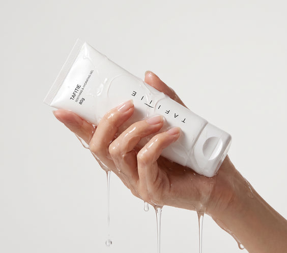 Hand squeezing TAFITIE ultrasound conductive gel tube with clear gel dripping