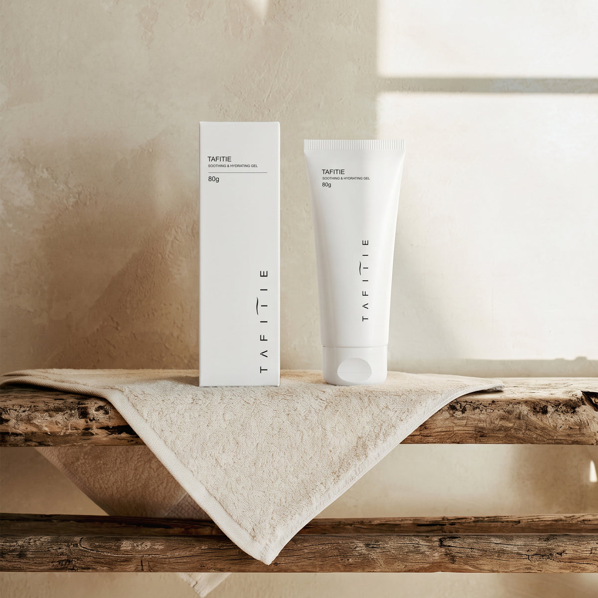 TAFITIE ultrasound conductive gel tube and box on a wooden shelf with linen towel