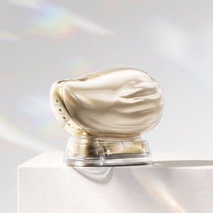 TAFITIE Conch facial device on charging base displayed on a white pedestal